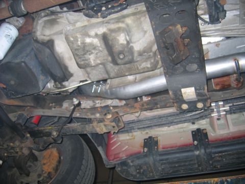 2000 Ford Excursion - The underside of a 2000 Ford Excursion reveals its exhaust system and transmission components.