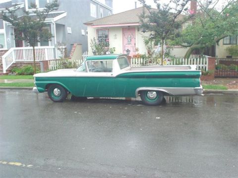 1959 Ford Ranchero - Green and white 1959 Ford Ranchero parked curbside on a rainy day.