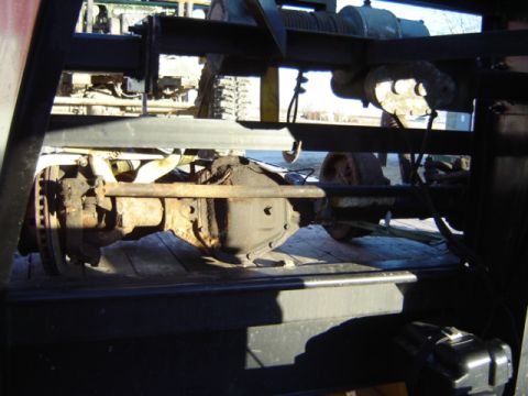 1992 Ford Bronco - This photo shows a close-up of a vehicle's axle and differential, likely a Dana 60, being transported.