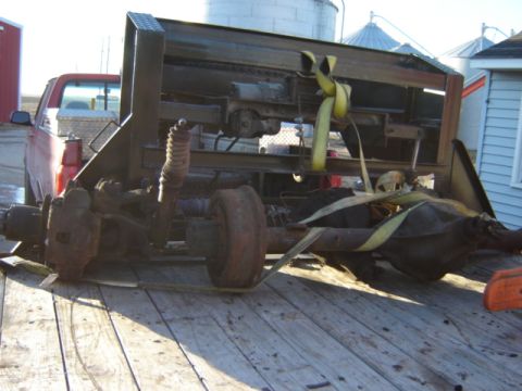 1992 Ford Bronco - A rear axle assembly, likely from a heavy-duty truck, is secured to a trailer for transport.