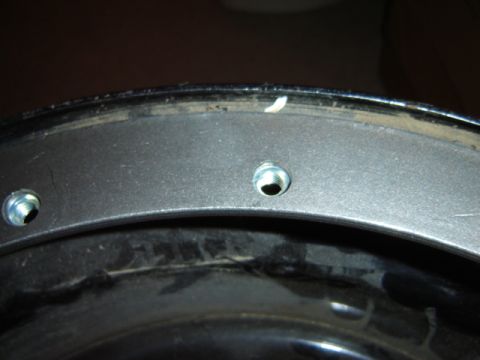 1992 Ford Bronco - This image shows a close-up view of a vehicle's wheel hub, highlighting the lug nut mounting points.