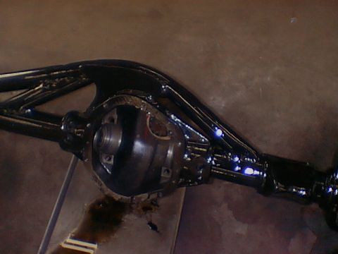 1979 Ford Bronco - Close-up of a black rear differential assembly, likely undergoing maintenance or modification.