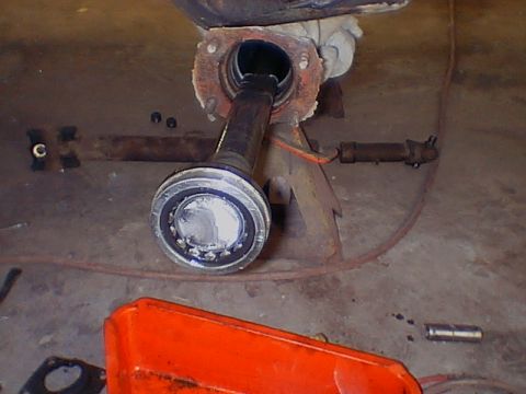 1979 Ford Bronco - Vehicle axle assembly removed and supported by jack stands for maintenance or repair.