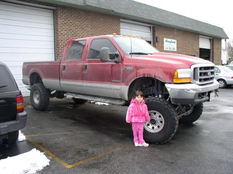 2000 Ford Excursion - My daughter next to a buddys f-350 w/10 inches of lift