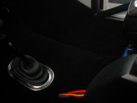 1978 Ford Bronco - Close-up of the interior, showing the shifter boot and some exposed wiring.