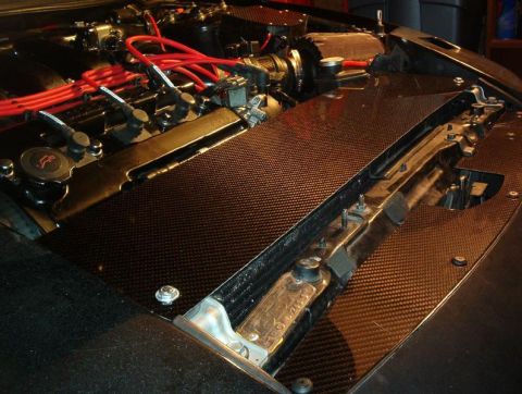 1995 Ford Probe - Engine bay components with carbon fiber accents and red spark plug wires visible.