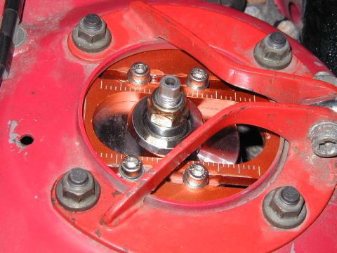 1994 Ford Probe - This is a close-up view of an adjustable strut mount, showing its intricate mechanical components and measurement markings.