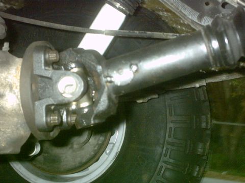 1992 Ford Bronco - Close-up view of a driveshaft U-joint, with a Supermotors.net watermark visible.