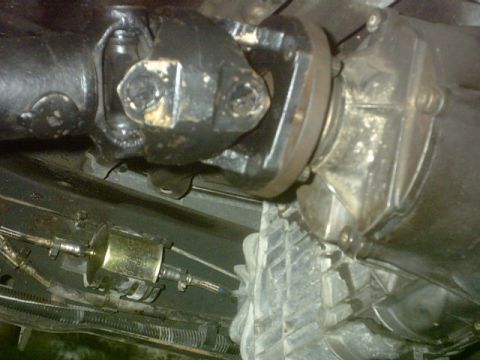 1992 Ford Bronco - Underside view of vehicle driveshaft and transmission components, including a fuel filter.