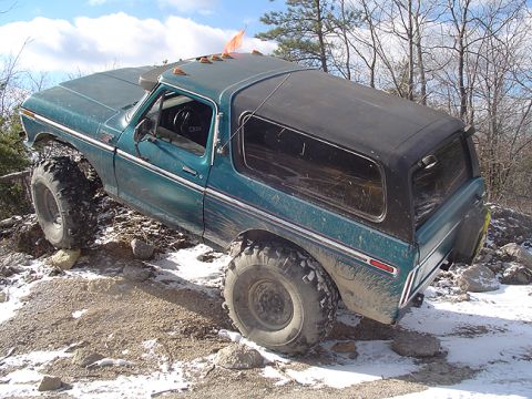 1979 Ford Bronco - This 1979 Ford Bronco navigates a challenging off-road course with large tires and a lifted suspension.