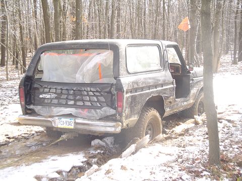 1979 Ford Bronco - This 1979 Ford Bronco is seen stuck in a muddy and snowy wooded area.