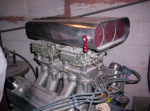 1971 Ford Mustang - Engine part with "Ford Motorsport" visible on the valve cover and a "Weiand" intake manifold.