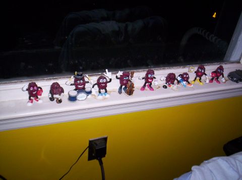 1971 Ford Mustang - A collection of raisin figures are arranged on a windowsill, some appearing to play musical instruments.