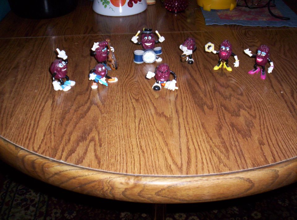 California Raisins toys on a wooden table