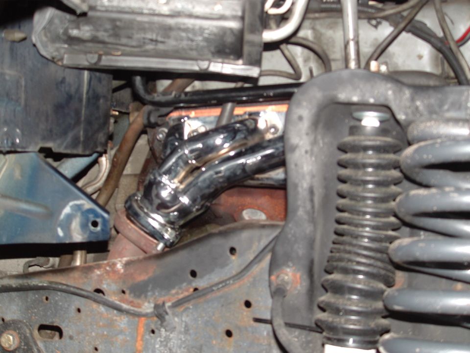 Chrome exhaust headers and black coil spring with rubber boot