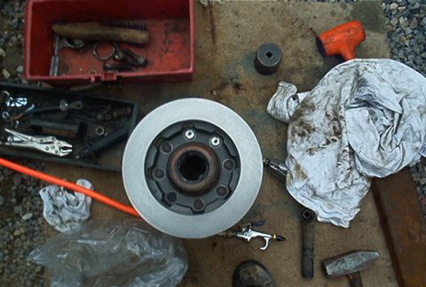 1986 Ford Bronco - Placed rotor on hub. Slammed the wheel studs home.