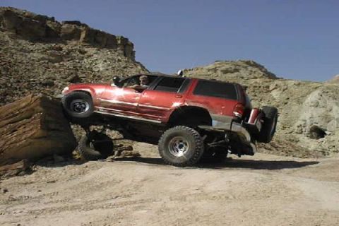 1997 Ford Ranger - Jeff, in our group, gets a wheel up on top of a 5 ft high rock