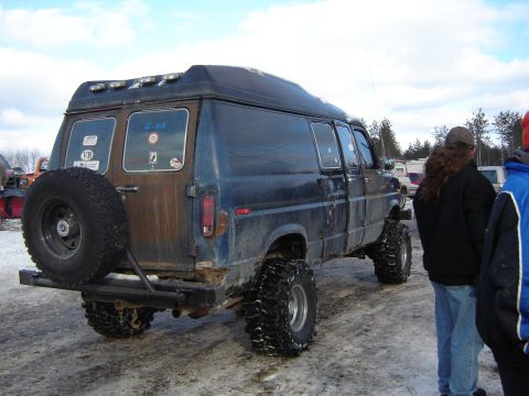 1978 Chevrolet C/K Pickup - This lifted van features oversized tires and a rear-mounted spare, suggesting off-road capability.