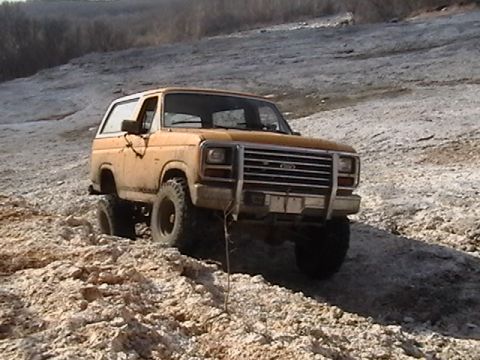 1986 Ford Bronco - This 1980s Ford Bronco navigates a rocky, off-road terrain.