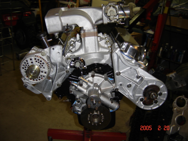 Rebuilt V-engine on a stand with alternator, intake and front hubs fitted, dated Feb 2005
