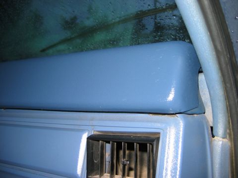 1985 Ford Bronco - Interior view of a blue dashboard cover and air vent, consistent with a 1985 Ford Bronco.