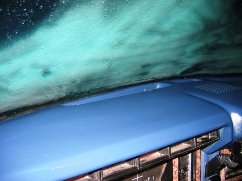 1985 Ford Bronco - Interior view of a 1985 Ford Bronco dashboard, showing the blue dash cover and air vents.