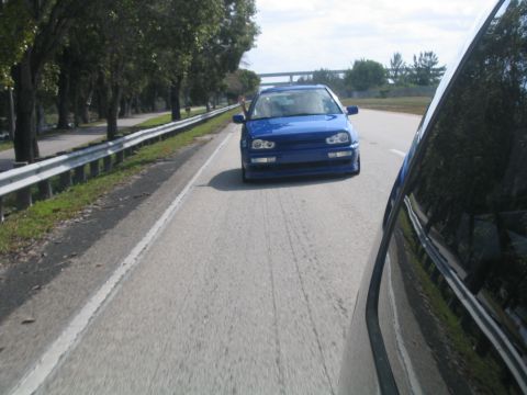 1998 Volkswagen Jetta - A blue Volkswagen Golf Mk3 is seen from the perspective of another vehicle on a highway.