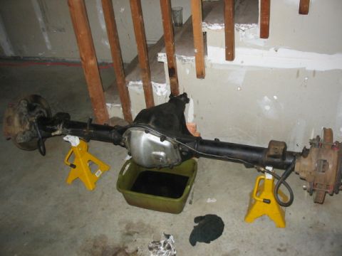 1995 Ford Bronco - Ford rear axle assembly, likely from a Bronco or similar truck, undergoing maintenance or modification.