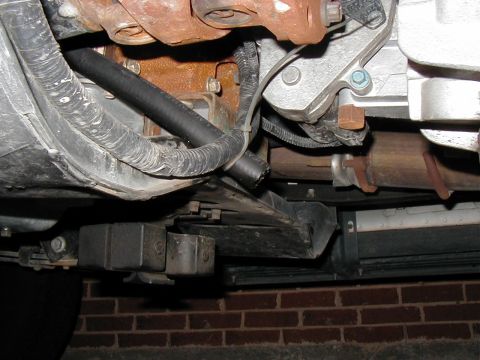 2002 Ford Excursion - A shot of the 3/4" coolant hose ending just a couple inches past the tranny crossmember/support