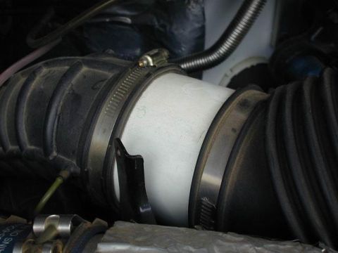 2002 Ford Excursion - 4" piece of PVC pipe in place of the stock fume collector unit(Photo author unknown)