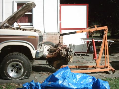 1982 Ford Bronco - A 1980 Ford Bronco is undergoing engine removal with an engine hoist.