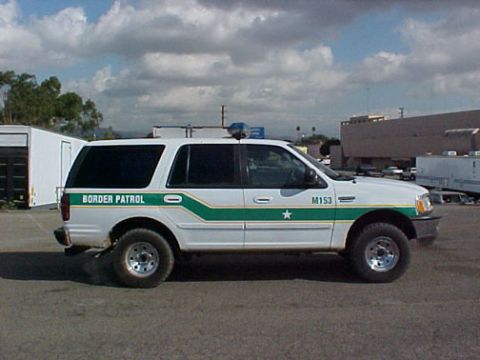 1993 Ford Bronco - Side view of a white Ford Expedition marked for Border Patrol duty.