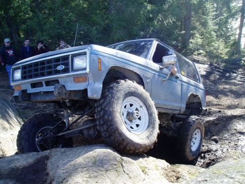 1984 Ford Bronco II - This lifted 1984 Ford Bronco II navigates a rocky trail with impressive articulation.