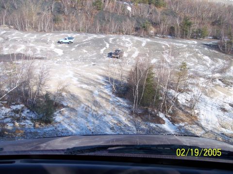 1995 Ford Bronco - Two off-road vehicles navigate a quarry on a winter day. The date stamp indicates the photo was taken on February 19, 2005.