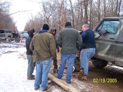 1995 Ford Bronco - Men gather around a truck in a wooded area on a snowy day. Date stamp reads 02/19/2005.