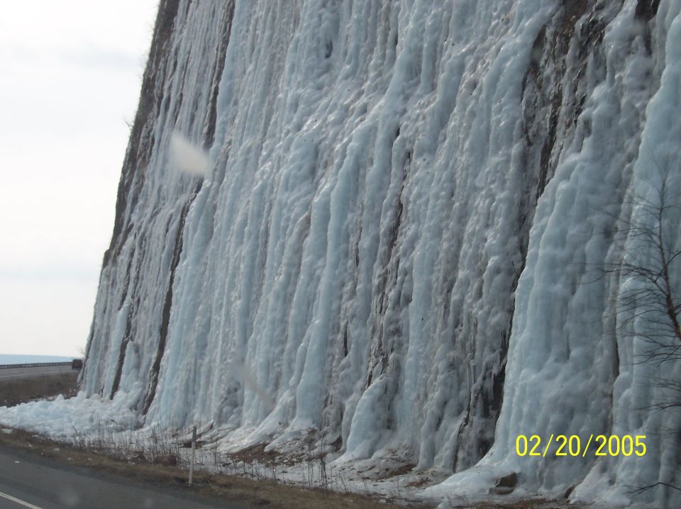 frozen waterfall on cliff face next to a road, dated 02/20/2005
