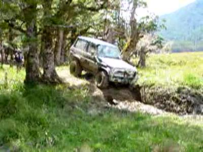 1989 Nissan Patrol - SWB Toyota LandCruiser Prado on Baja Claws tackles a deep hole.