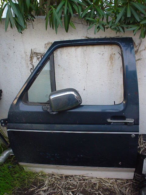 1993 Ford Bronco - This is a dark blue door for a 1993 Ford Bronco, a chrome side mirror and a thin chrome trim line.