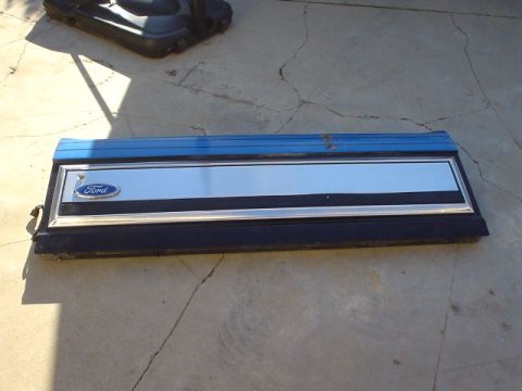 1993 Ford Bronco - Tailgate trim panel from a Ford truck or Bronco, a blue painted section and chrome insert.