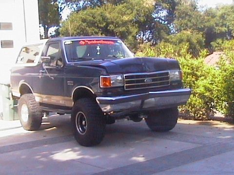 1991 Ford Bronco - This 1991 Ford Bronco features a lifted suspension and an aftermarket hood.