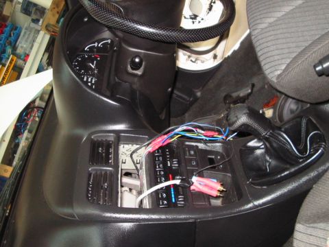 1994 Ford Probe - Exposed wiring and audio connections are visible in the car's interior, suggesting aftermarket audio installation.