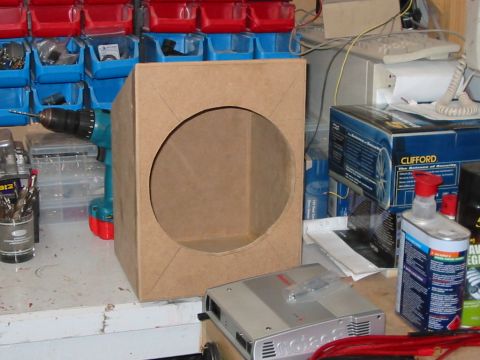1994 Ford Probe - Workbench setup with a custom speaker enclosure, car amplifier, and tools.
