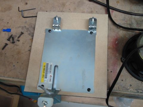 1994 Ford Probe - Electronic control unit with visible part numbers and labels, mounted on a wooden board.