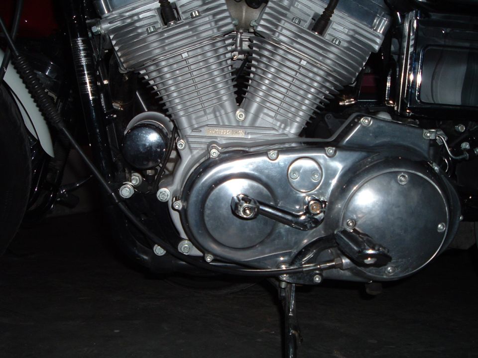 Chrome and aluminum V-twin motorcycle engine, right-side close-up