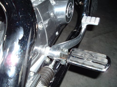 1995 Mercury Grand Marquis - Detail shot of motorcycle components including engine cover and footpeg.