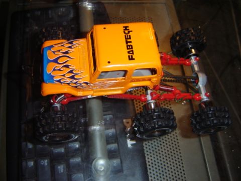 1992 Ford Bronco - This is a toy monster truck with custom flame decals and 'FABTECH' branding on the roof.