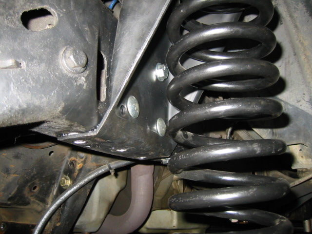Suspension coil and bracket assembly