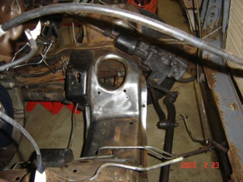 1990 Ford Bronco - Engine bay stripped to bare metal on the passenger side, with the shock tower and inner fender sanded clean and ready for paint. The steeri…