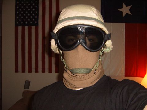 1988 Ford Bronco - A person in tactical gear poses for a photo with American and Texas flags in the background.