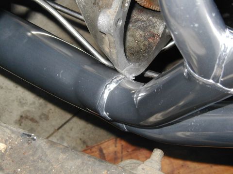 1968 Ford Mustang - Close-up view of exhaust headers, showing welds and attachment to engine components.